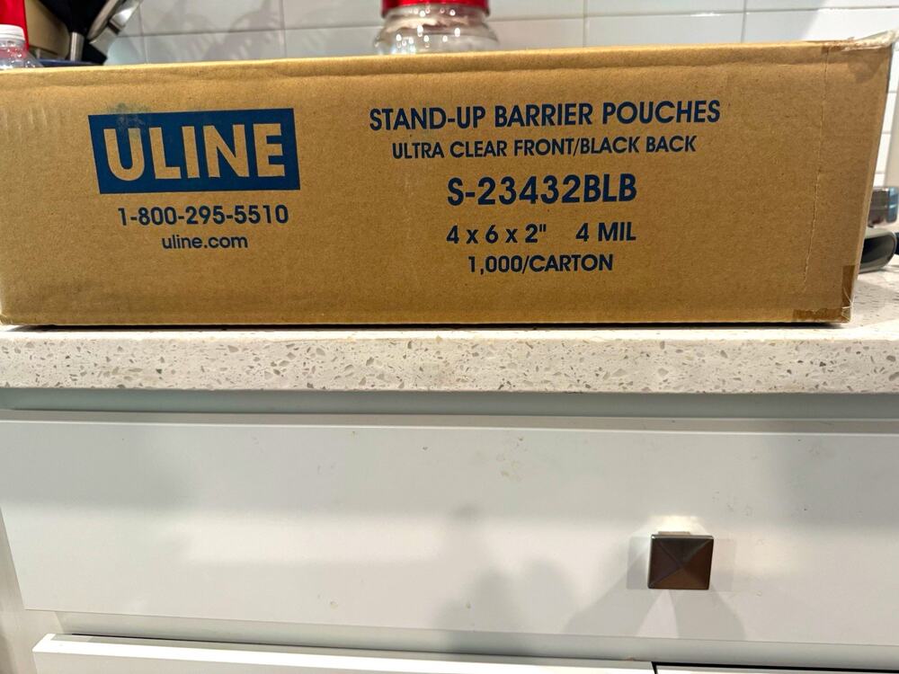 ULINE Stand-Up Resealable Barrier Pouches Clear/Black 4x6x2 4 mil S-23432BLB